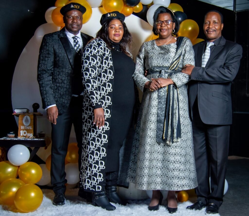 Leaders together at a TCI assembly celebration