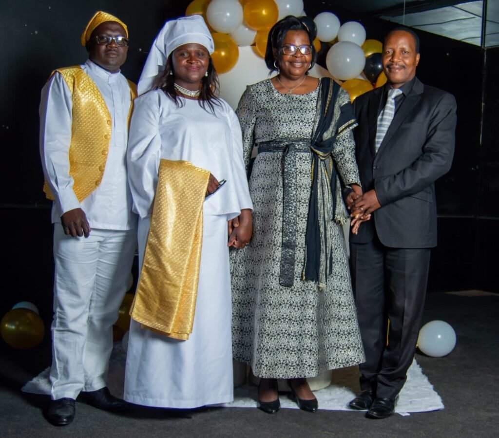 Leaders in ceremonial robes at a TCI assembly celebration