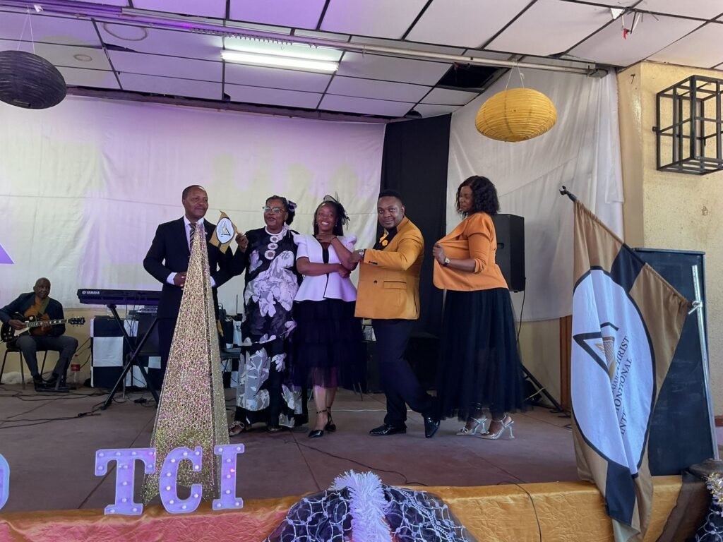 Ministers on stage at a TCI assembly