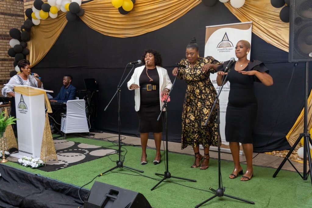 A worship team leading praise at a TCI assembly