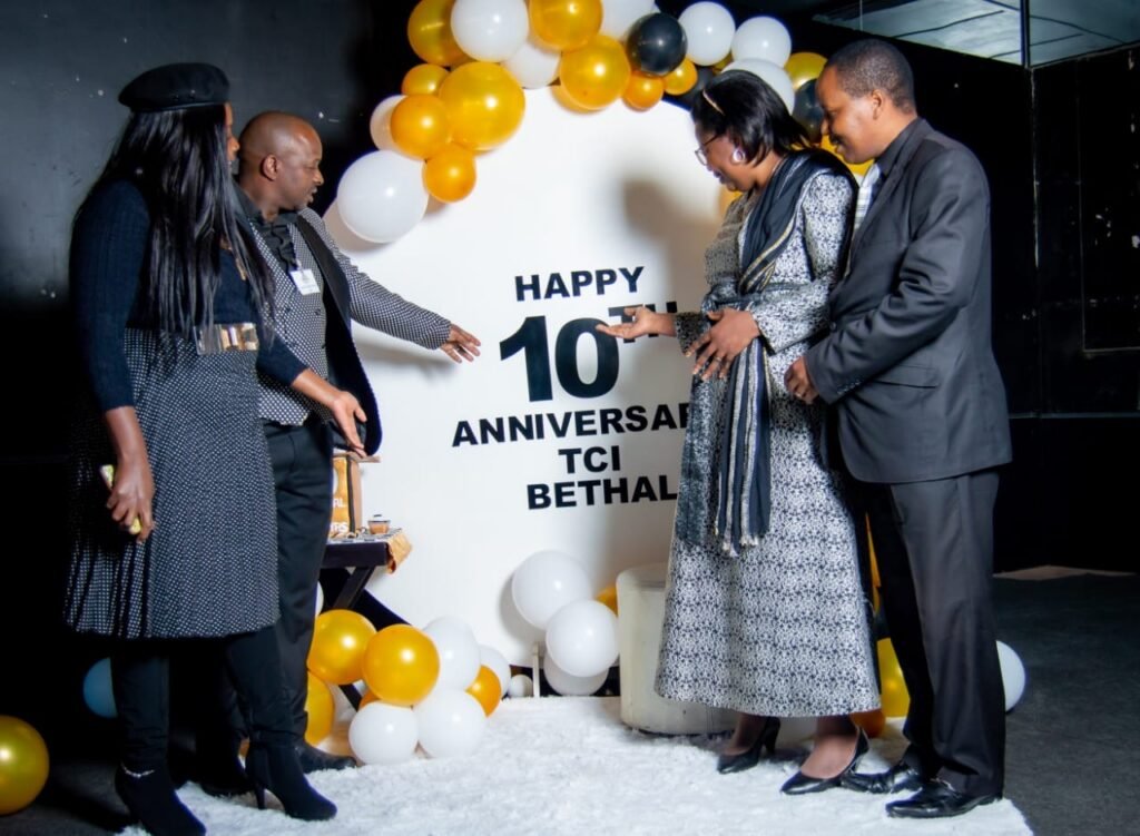 Cutting the cake at the TCI Bethal 10th anniversary