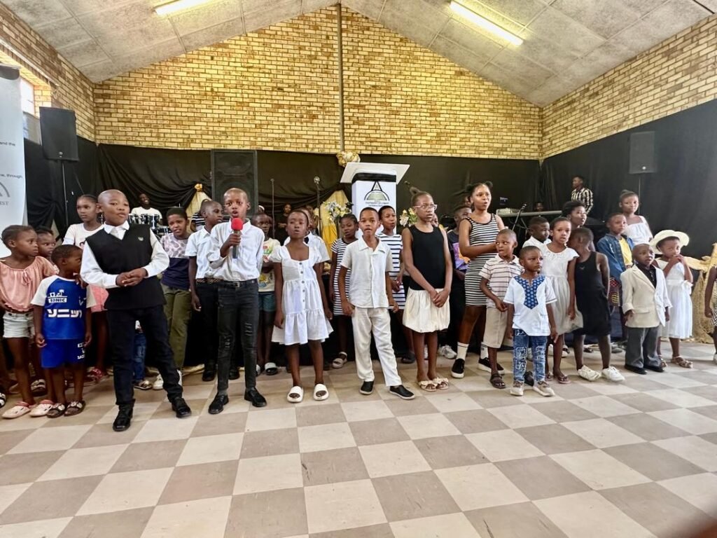 Children of the TCI Children's Ministry standing together in church