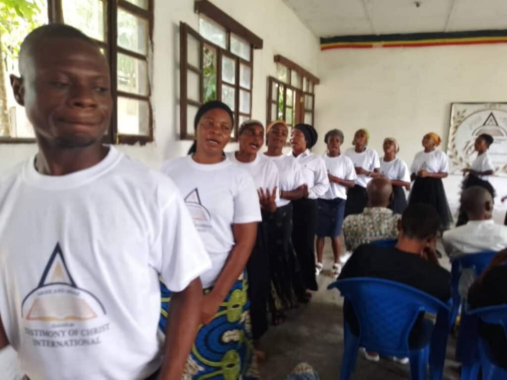 TCI DR Congo members in TCI T-shirts at a service