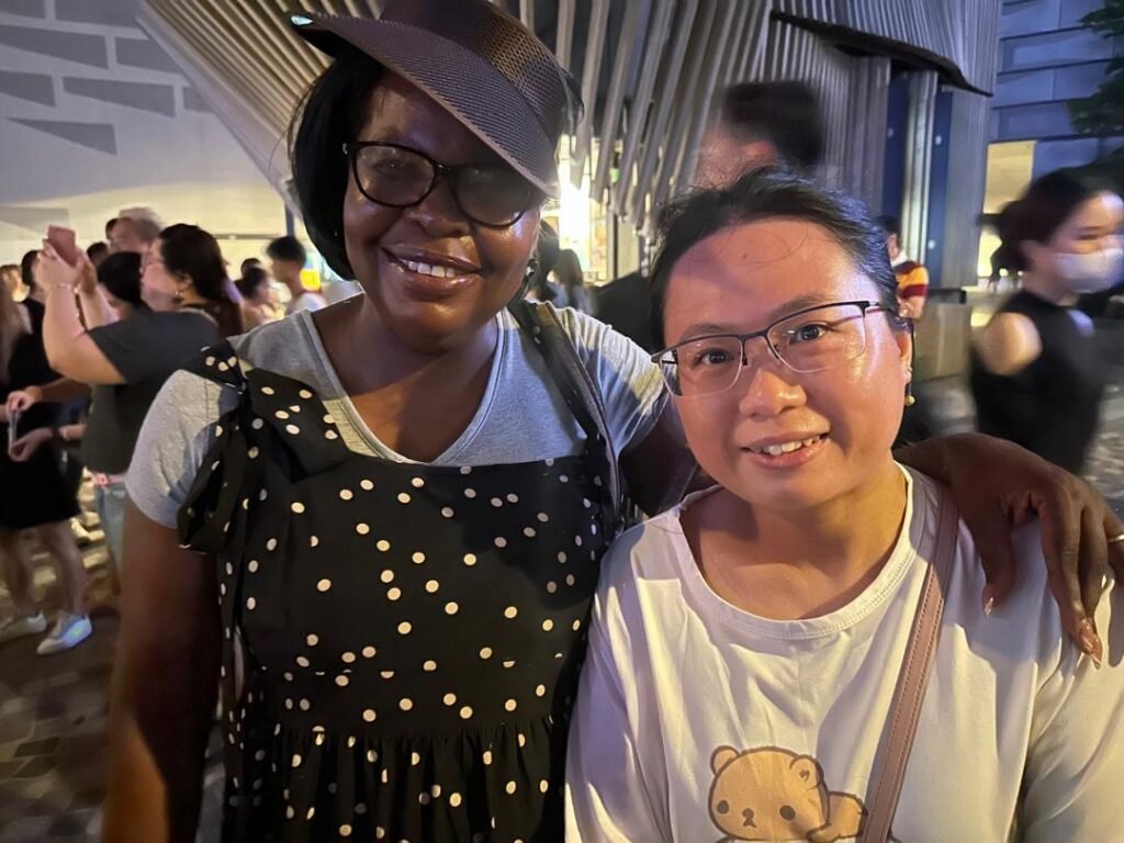A TCI minister with a new friend at an evening event during the Global Tour