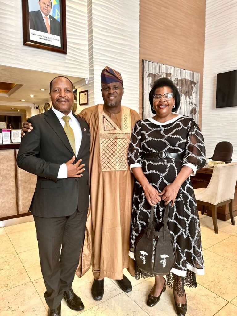 TCI leaders with a host in traditional dress during the Great Commission Global Tour