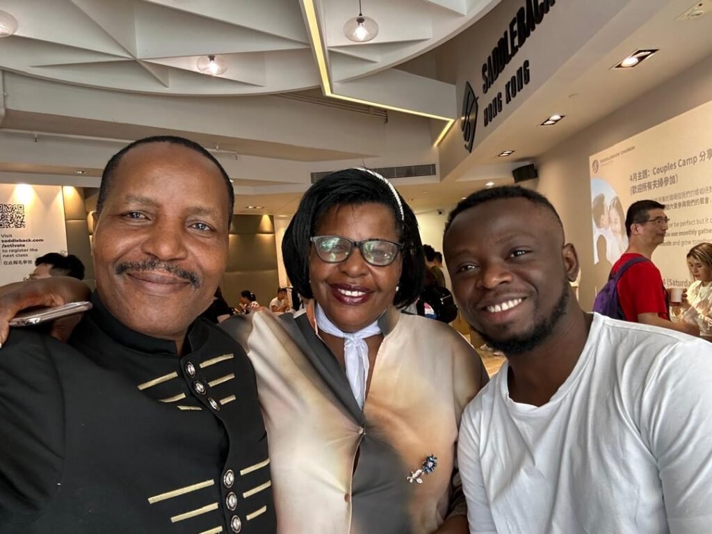 TCI leaders with a friend at a shopping centre during the Great Commission Global Tour