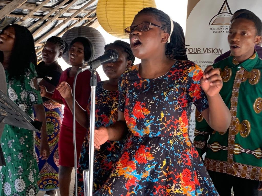 Women singing in worship at TCI Mozambique