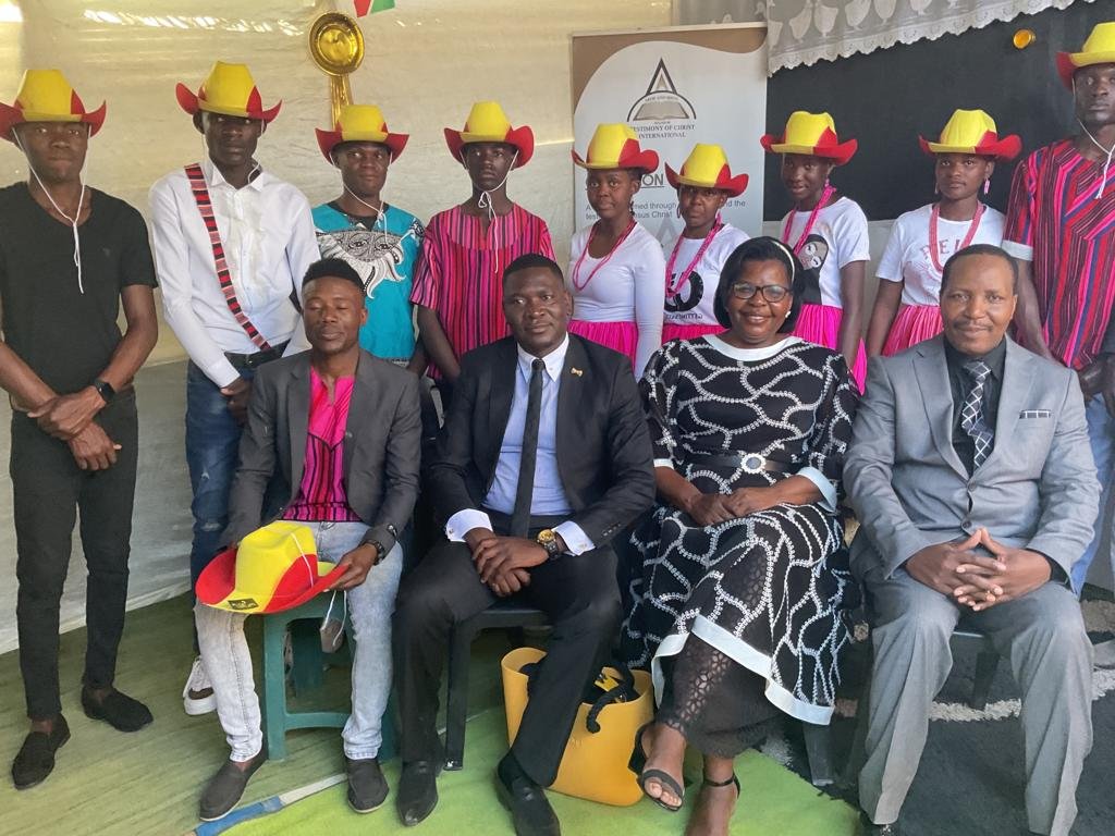 TCI Namibia members in matching red and yellow hats