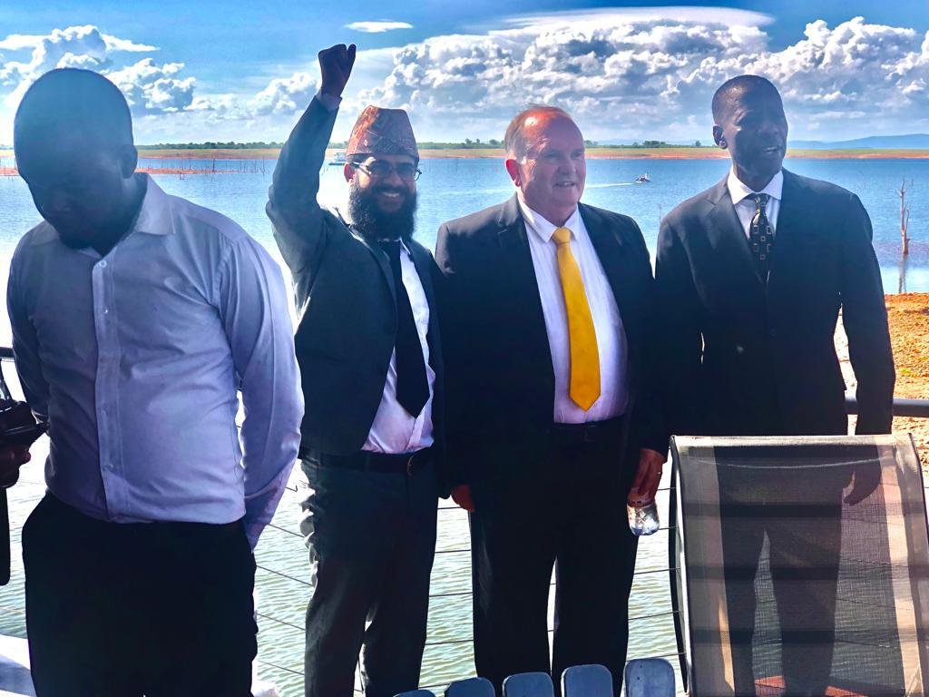 TCI Zimbabwe leaders gathered by the water