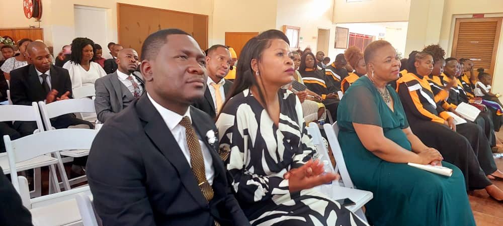 Couples seated together at a TCI service