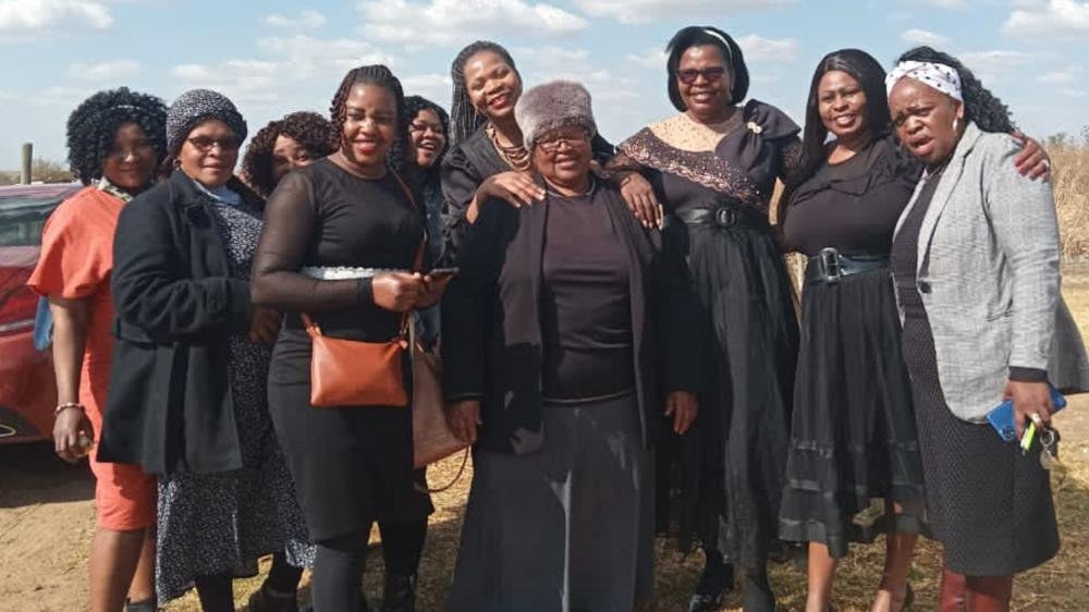 TCI women gathered together outdoors